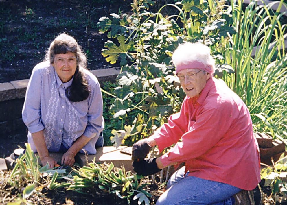 Donna and a second member of the prairie acre garden club in spring 2006 working in the garden