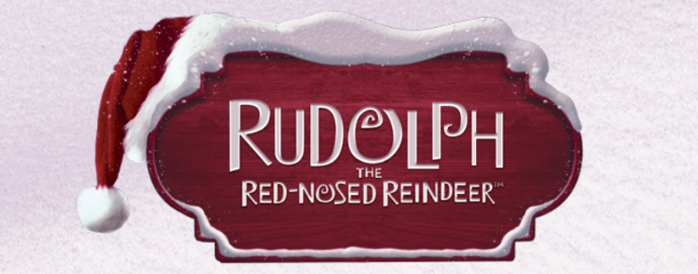 Snow falling down over a large wooden board reading Rudolph the Red Nosed Reindeer with a red Santa hat on the top left corner.