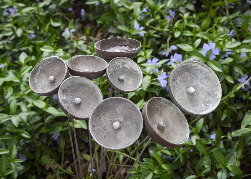 8 metal cups that look like abstract flowers but move in the wind to create a windchime effect