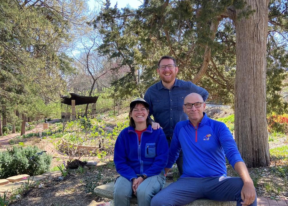 Author Sarah, volunteer Steve Sears, and program manager Nick Carswell sitting in the sensory garden on a sunny spring day